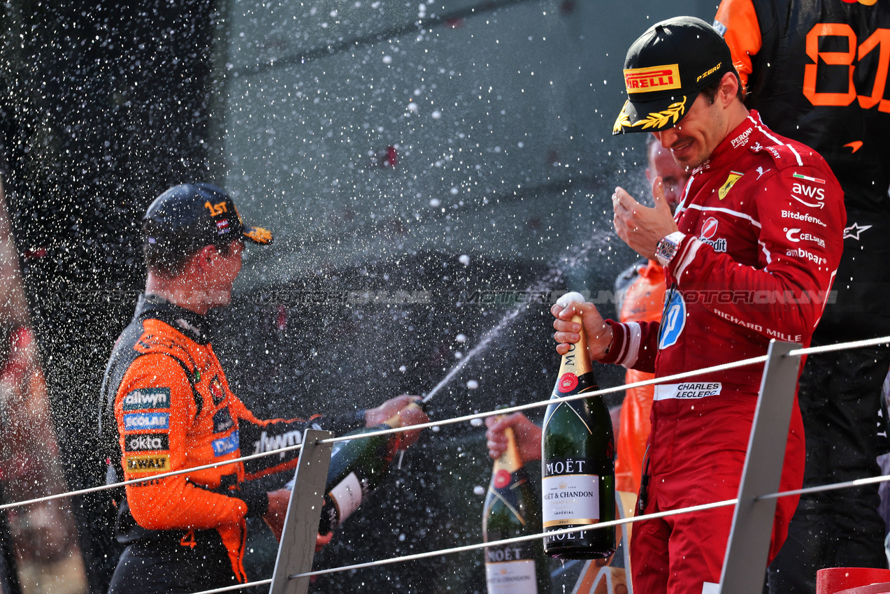 GP AUSTRIA, Gara winner Lando Norris (GBR) McLaren celebrates on the podium with third placed Charles Leclerc (MON) Ferrari.

29.06.2025. Formula 1 World Championship, Rd 11, Austrian Grand Prix, Spielberg, Austria, Gara Day.

- www.xpbimages.com, EMail: requests@xpbimages.com © Copyright: Moy / XPB Images