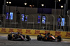 GP BAHRAIN, Lewis Hamilton (GBR) Ferrari SF-25 e Lando Norris (GBR) McLaren MCL39 battle for position.

13.04.2025. Formula 1 World Championship, Rd 4, Bahrain Grand Prix, Sakhir, Bahrain, Gara Day.

- www.xpbimages.com, EMail: requests@xpbimages.com © Copyright: Moy / XPB Images