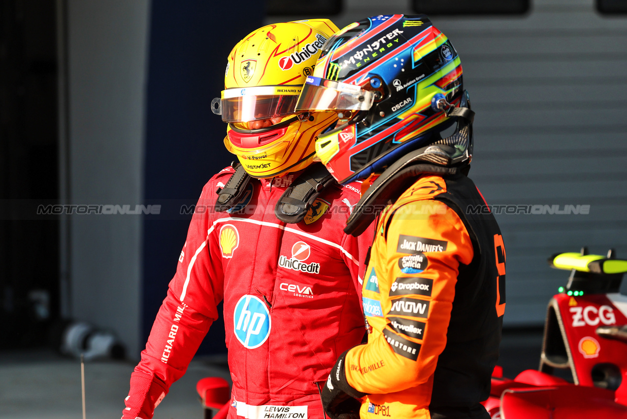 GP CINA, Lewis Hamilton (GBR) Ferrari celebrates his pole position in Sprint Qualifiche parc ferme with Oscar Piastri (AUS) McLaren.

21.03.2025. Formula 1 World Championship, Rd 2, Chinese Grand Prix, Shanghai, China, Sprint Qualifiche Day.

- www.xpbimages.com, EMail: requests@xpbimages.com © Copyright: Batchelor / XPB Images