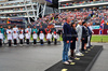 GP GRAN BRETAGNA, Stefano Domenicali (ITA) Formula One President e CEO e Mohammed Bin Sulayem (UAE) FIA President as the grid observes the national anthem.

06.07.2025. Formula 1 World Championship, Rd 12, British Grand Prix, Silverstone, England, Gara Day.

- www.xpbimages.com, EMail: requests@xpbimages.com © Copyright: Batchelor / XPB Images