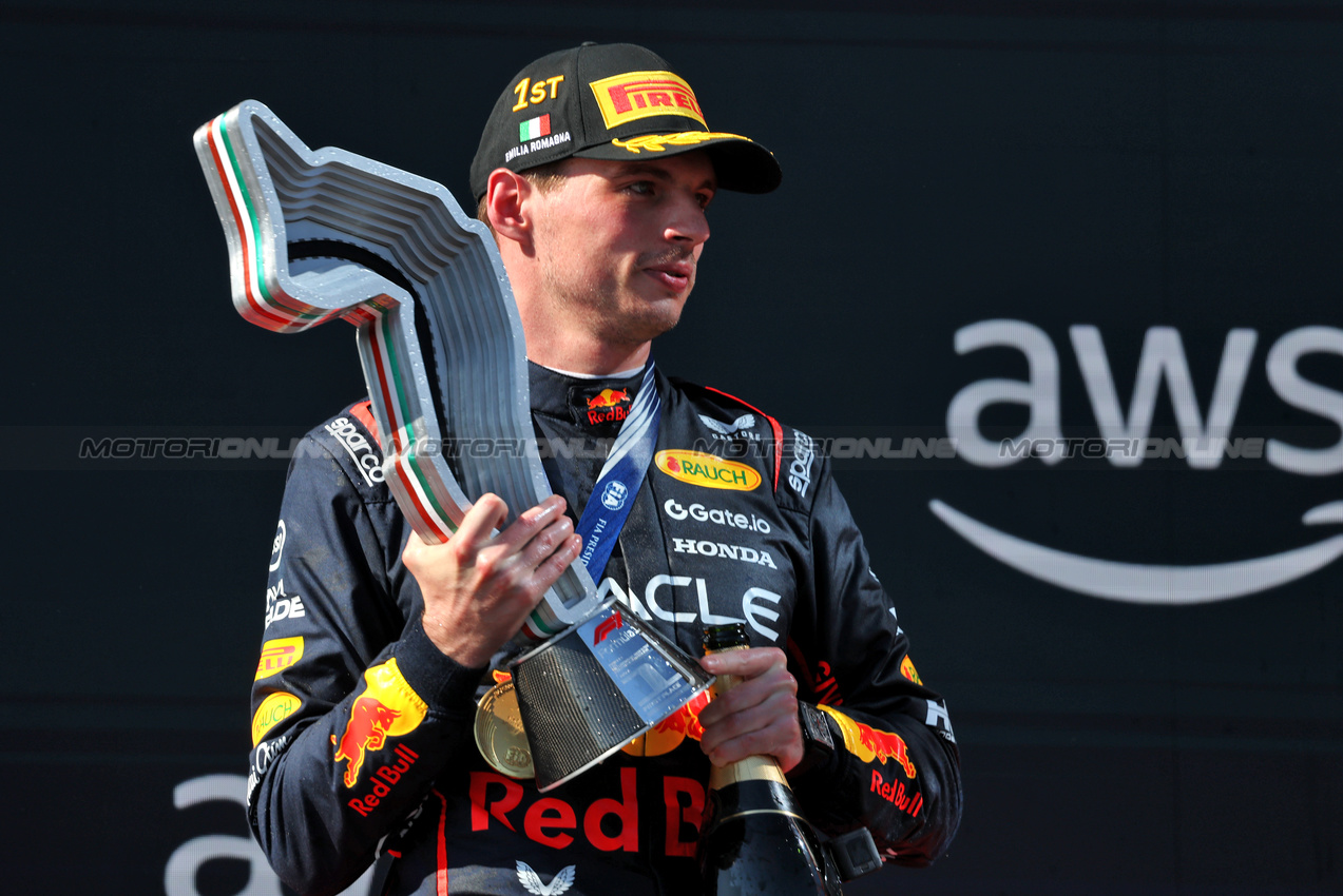 GP IMOLA, Gara winner Max Verstappen (NLD) Red Bull Racing celebrates on the podium.

18.05.2025. Formula 1 World Championship, Rd 7, Emilia Romagna Grand Prix, Imola, Italy, Gara Day.

- www.xpbimages.com, EMail: requests@xpbimages.com © Copyright: Charniaux / XPB Images