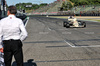 GP IMOLA, Thierry Boutsen (BEL) pushes his 1985 Arrows A8 as Stefano Domenicali (ITA) Formula One President e CEO waits with the chequered flag.

17.05.2025. Formula 1 World Championship, Rd 7, Emilia Romagna Grand Prix, Imola, Italy, Qualifiche Day.

- www.xpbimages.com, EMail: requests@xpbimages.com © Copyright: Batchelor / XPB Images