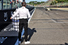 GP IMOLA, Thierry Boutsen (BEL) in his 1985 Arrows A8 as Stefano Domenicali (ITA) Formula One President e CEO waits with the chequered flag.

17.05.2025. Formula 1 World Championship, Rd 7, Emilia Romagna Grand Prix, Imola, Italy, Qualifiche Day.

- www.xpbimages.com, EMail: requests@xpbimages.com © Copyright: Batchelor / XPB Images
