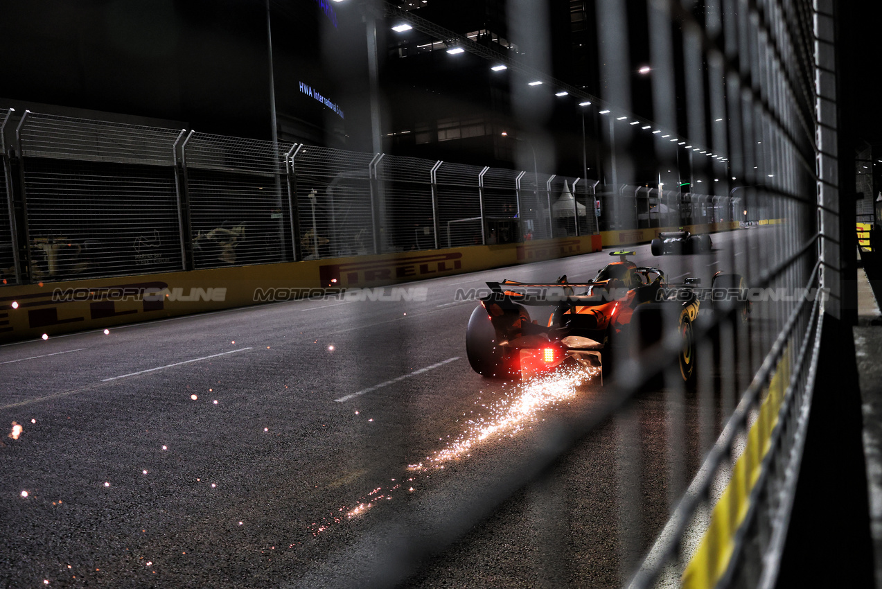 GP SINGAPORE, Lando Norris (GBR) McLaren MCL39 sends sparks flying.

03.10.2025. Formula 1 World Championship, Rd 18, Singapore Grand Prix, Marina Bay Street Circuit, Singapore, Practice Day.

- www.xpbimages.com, EMail: requests@xpbimages.com © Copyright: Charniaux / XPB Images
