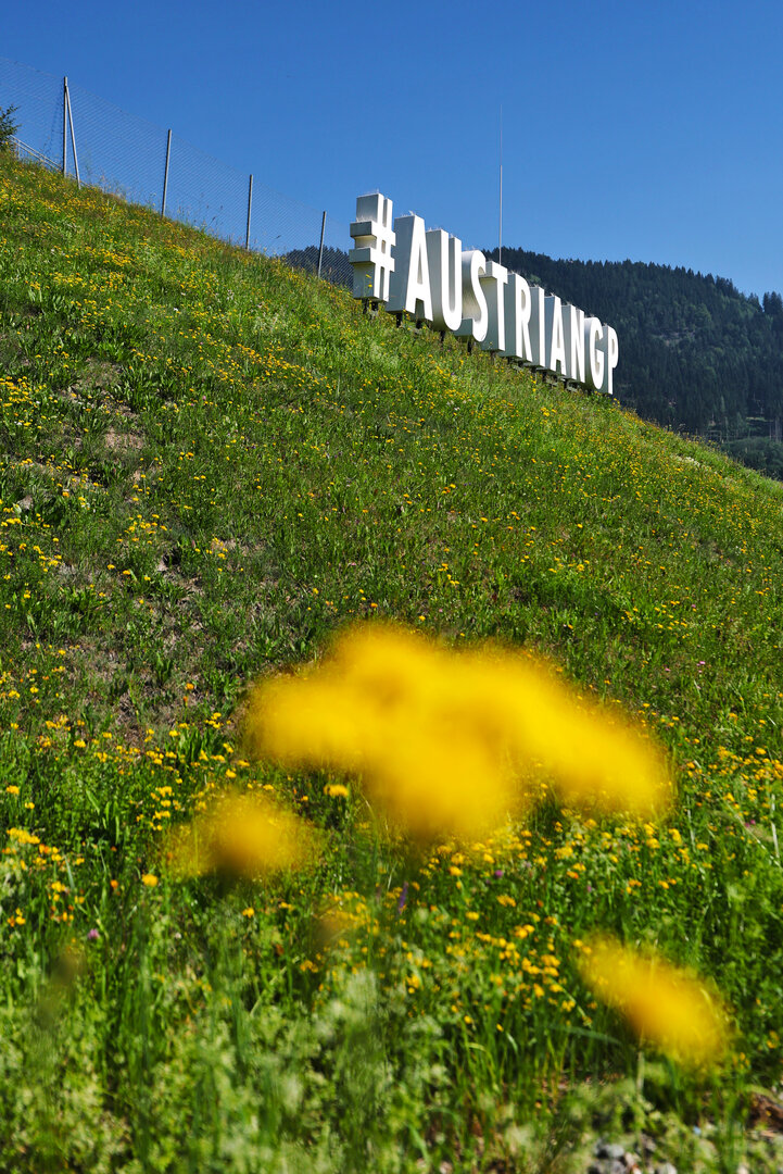 GP AUSTRIA, Circuit Atmosfera - #AustrianGP sign trackside.
25.06.2026. Formula 1 World Championship, Rd 8, Austrian Grand Prix, Spielberg, Austria, Preparation Day.
- www.xpbimages.com, EMail: requests@xpbimages.com © Copyright: Moy / XPB Images