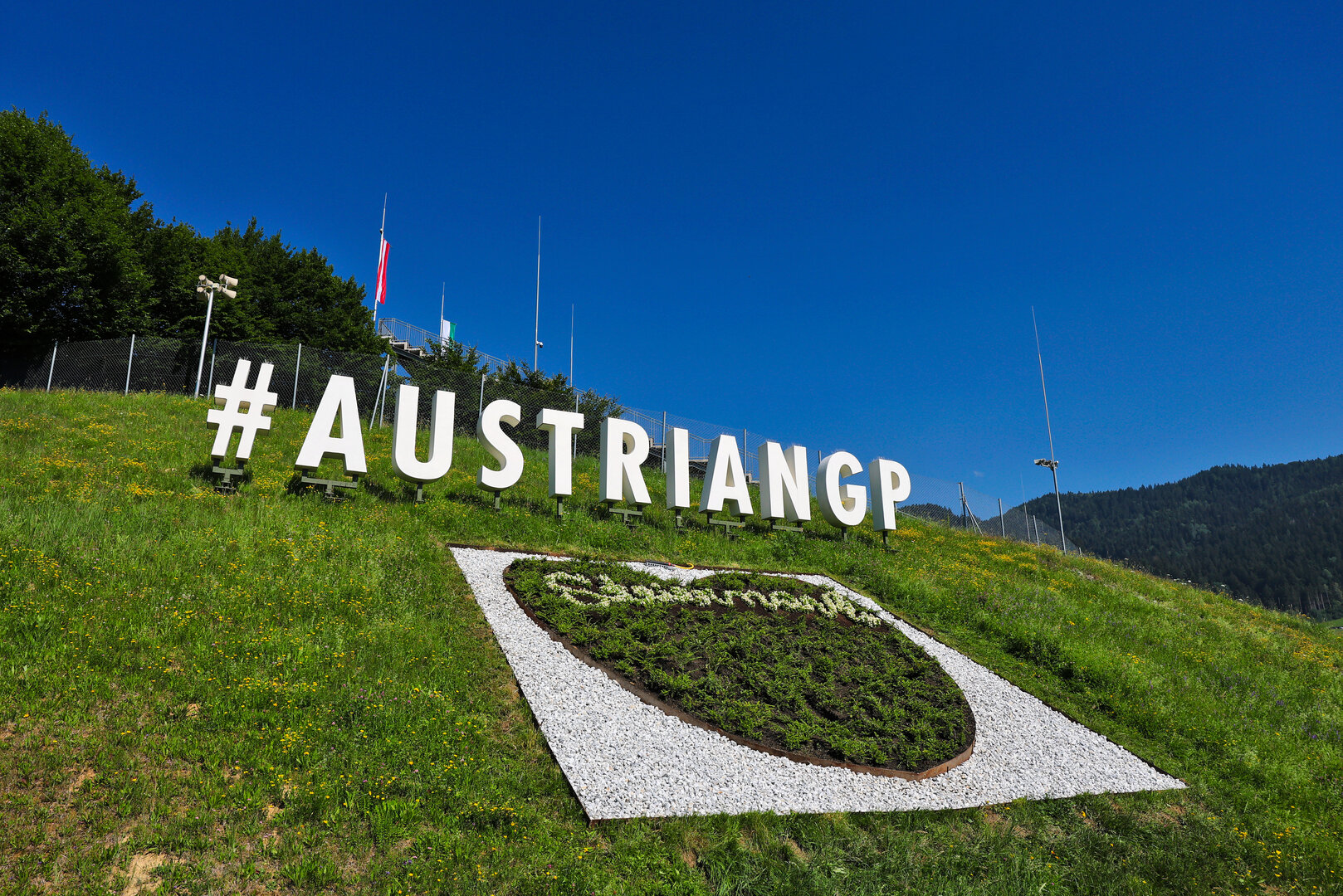 GP AUSTRIA, Circuit Atmosfera - #AustrianGP sign trackside.
25.06.2026. Formula 1 World Championship, Rd 8, Austrian Grand Prix, Spielberg, Austria, Preparation Day.
- www.xpbimages.com, EMail: requests@xpbimages.com © Copyright: Moy / XPB Images