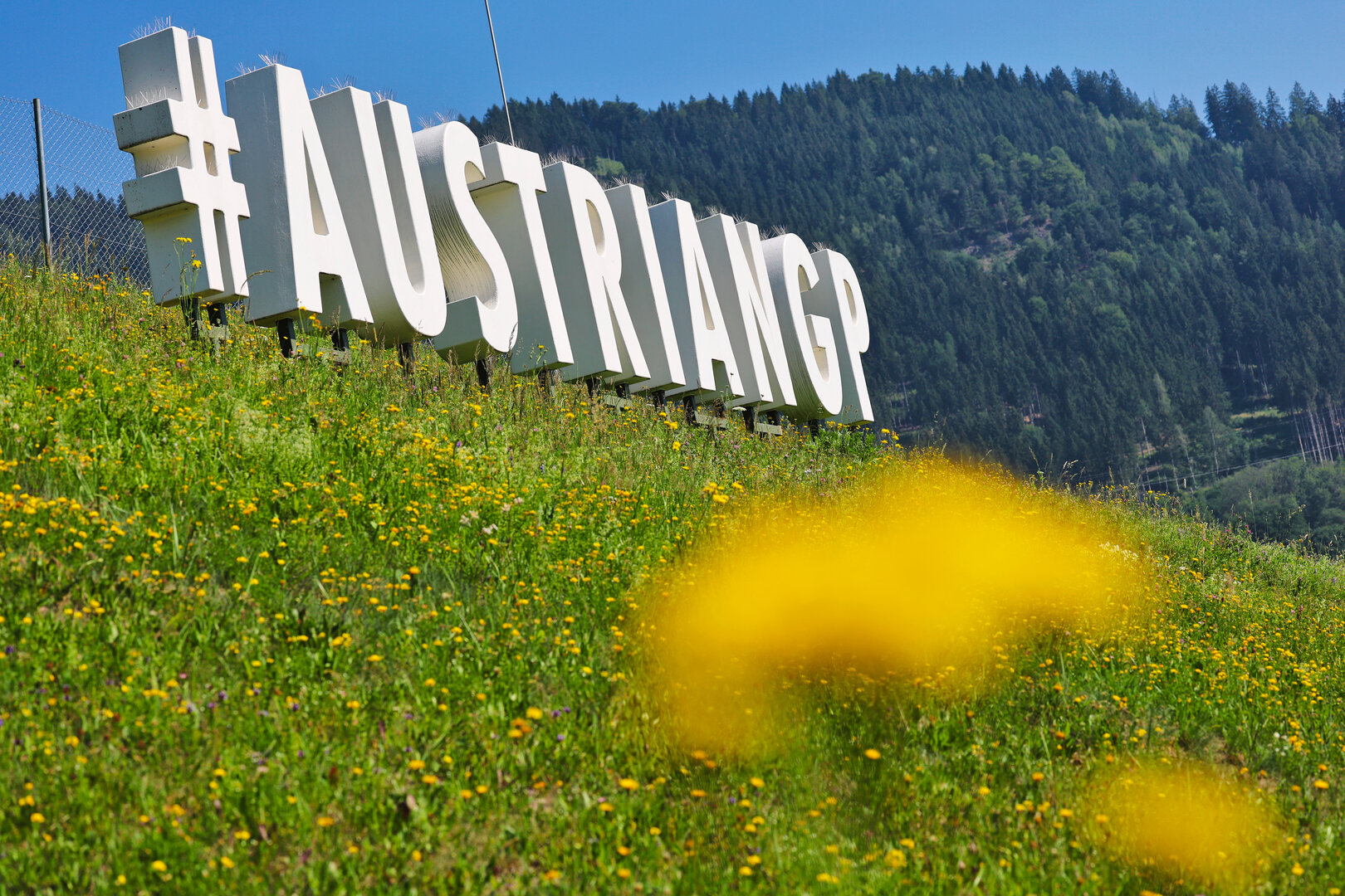 GP AUSTRIA, Circuit Atmosfera - #AustrianGP sign trackside.
25.06.2026. Formula 1 World Championship, Rd 8, Austrian Grand Prix, Spielberg, Austria, Preparation Day.
- www.xpbimages.com, EMail: requests@xpbimages.com © Copyright: Moy / XPB Images