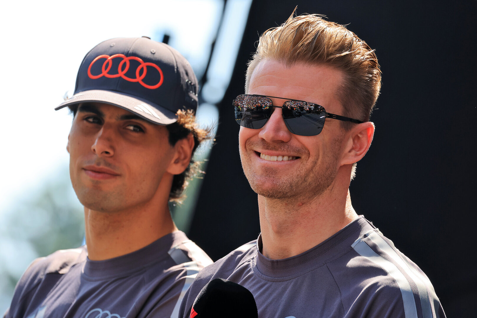 GP AUSTRIA, Nico Hulkenberg (GER) Audi F1 Team (Centre) with team mate Gabriel Bortoleto (BRA) Audi F1 Team (Left) on the FanZone Stage.
27.06.2026. Formula 1 World Championship, Rd 8, Austrian Grand Prix, Spielberg, Austria, Qualifiche Day.
- www.xpbimages.com, EMail: requests@xpbimages.com © Copyright: Moy / XPB Images
