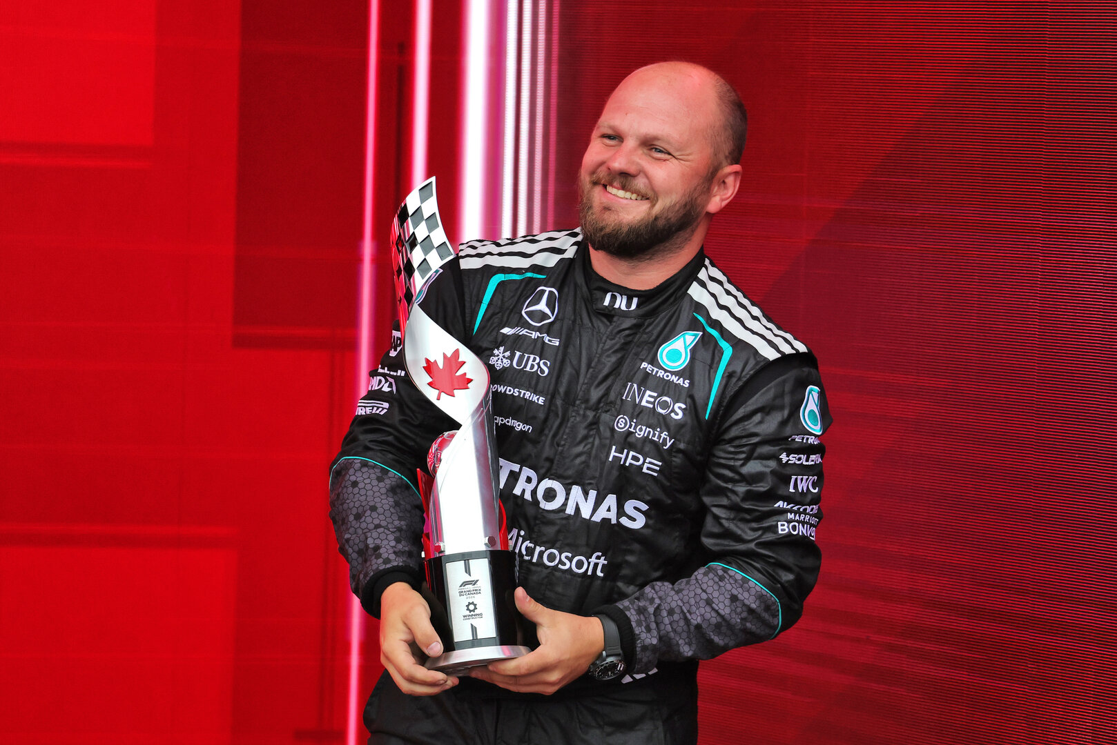 GP CANADA, Dean Hale (GBR) Mercedes AMG F1 Formula One Team Senior Travelling Composite Technician celebrates on the podium.
24.05.2026. Formula 1 World Championship, Rd 5, Canadian Grand Prix, Montreal, Canada, Gara Day.
- www.xpbimages.com, EMail: requests@xpbimages.com © Copyright: Moy / XPB Images