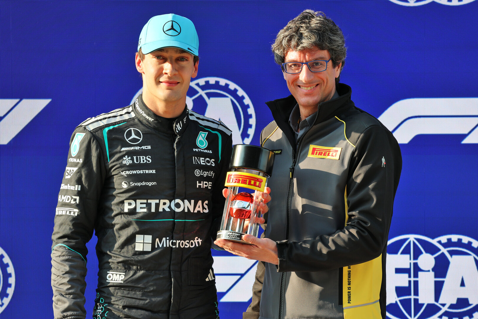 GP CINA, (L to R): George Russell (GBR) Mercedes AMG Formula One Team celebrates pole position in Sprint qualifying parc ferme with Dario Marrafuschi (ITA) Head of Pirelli Motorsport Business Unit.
13.03.2026. Formula 1 World Championship, Rd 2, Chinese Grand Prix, Shanghai, China, Sprint Qualifiche Day.
- www.xpbimages.com, EMail: requests@xpbimages.com © Copyright: Batchelor / XPB Images