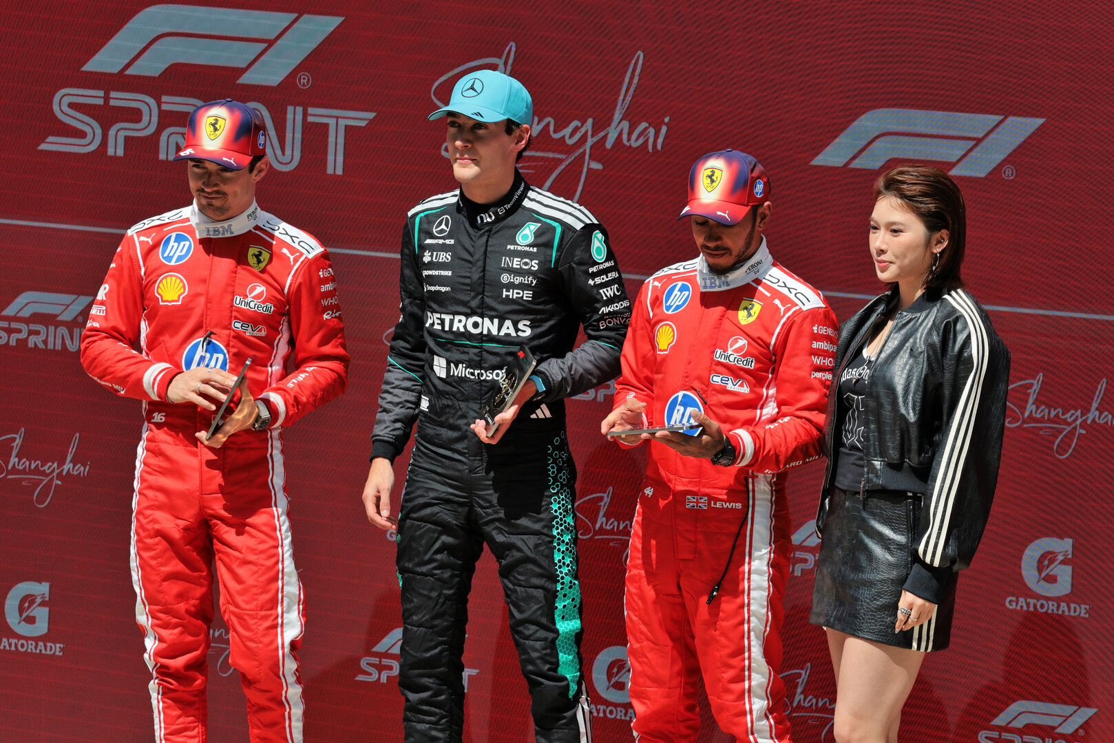 GP CINA, Top three in Sprint parc ferme (L to R): Charles Leclerc (MON) Ferrari, second; George Russell (GBR) Mercedes AMG Formula One Team, vincitore; Lewis Hamilton (GBR) Ferrari, third; Wu Yanni (CHN) Athlete. 
14.03.2026. Formula 1 World Championship, Rd 2, Chinese Grand Prix, Shanghai, China, Sprint e Qualifiche Day.
- www.xpbimages.com, EMail: requests@xpbimages.com © Copyright: Moy / XPB Images