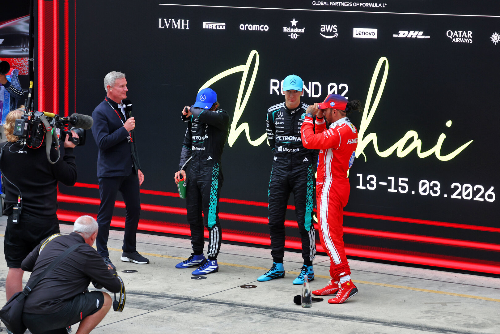 GP CINA, (L to R): David Coulthard (GBR) Channel 4 F1 Commentator with vincitore Andrea Kimi Antonelli (ITA) Mercedes AMG Formula One Team; second placed George Russell (GBR) Mercedes AMG Formula One Team; e third placed Lewis Hamilton (GBR) Ferrari in parc ferme.
15.03.2026. Formula 1 World Championship, Rd 2, Chinese Grand Prix, Shanghai, China, Gara Day.
 - www.xpbimages.com, EMail: requests@xpbimages.com © Copyright: Patching / XPB Images