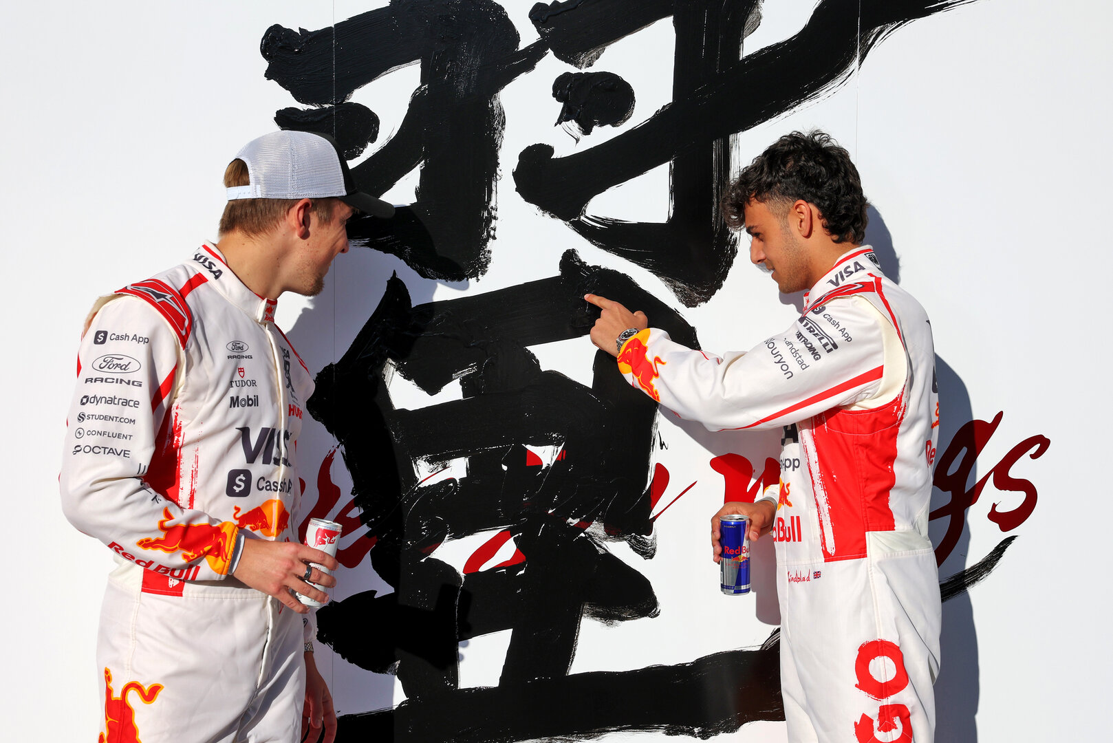 GP GIAPPONE, (L to R): Liam Lawson (NZL) Racing Bulls Formula One Team with team mate Arvid Lindblad (GBR) Racing Bulls Formula One Team.
26.03.2026. Formula 1 World Championship, Rd 3, Japanese Grand Prix, Suzuka, Japan, Preparation Day.
- www.xpbimages.com, EMail: requests@xpbimages.com © Copyright: Bearne / XPB Images