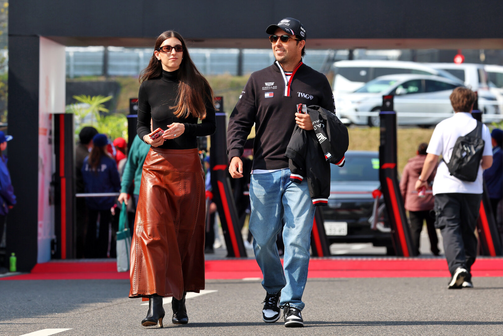 GP GIAPPONE, (L to R): Carola Martinez (MEX) with her husband Sergio Perez (MEX) Cadillac Formula 1 Team.
28.03.2026. Formula 1 World Championship, Rd 3, Japanese Grand Prix, Suzuka, Japan, Qualifiche Day.
- www.xpbimages.com, EMail: requests@xpbimages.com © Copyright: Rew / XPB Images