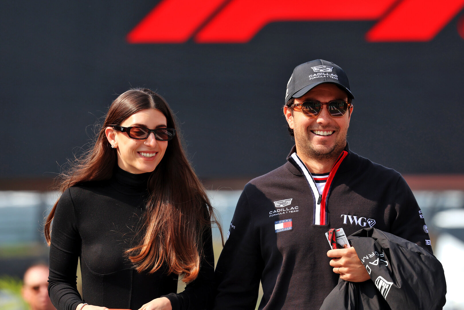 GP GIAPPONE, (L to R): Carola Martinez (MEX) with her husband Sergio Perez (MEX) Cadillac Formula 1 Team.
28.03.2026. Formula 1 World Championship, Rd 3, Japanese Grand Prix, Suzuka, Japan, Qualifiche Day.
 - www.xpbimages.com, EMail: requests@xpbimages.com © Copyright: Rew / XPB Images