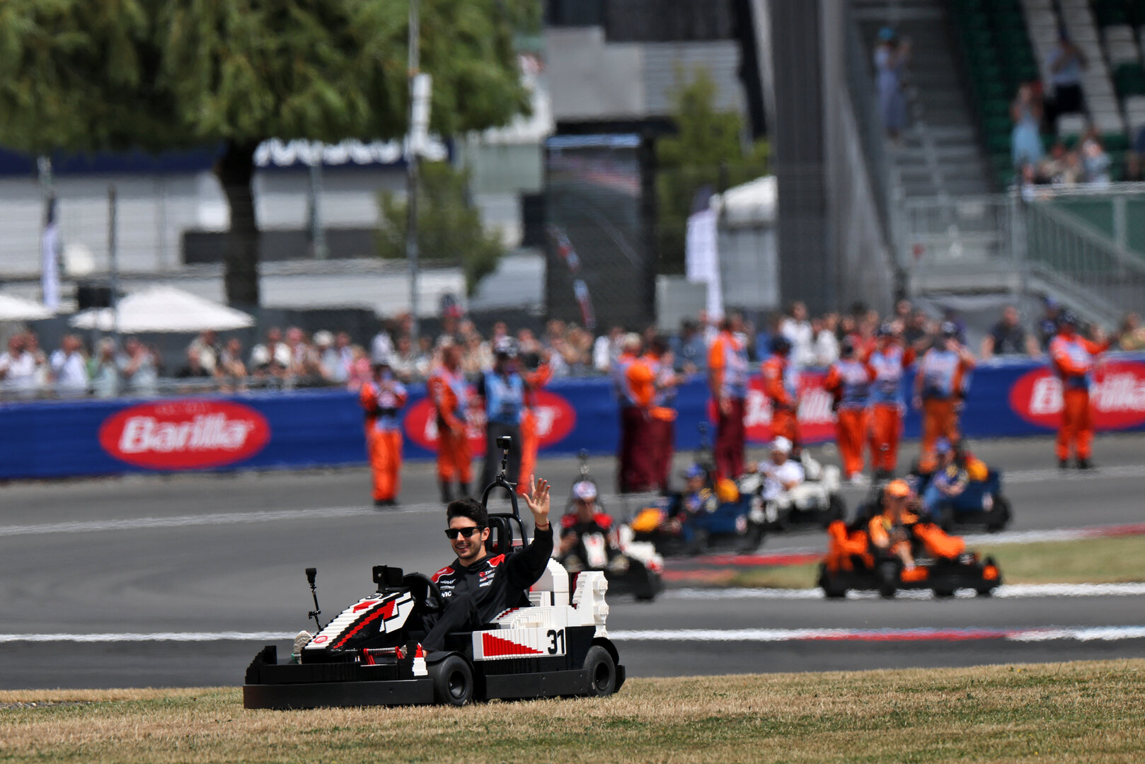 GP GRAN BRETAGNA, Esteban Ocon (FRA) Haas F1 Team in a Lego kart on the drivers' parade.
05.07.2026. Formula 1 World Championship, Rd 9, British Grand Prix, Silverstone, England, Gara Day.
- www.xpbimages.com, EMail: requests@xpbimages.com © Copyright: Charniaux / XPB Images