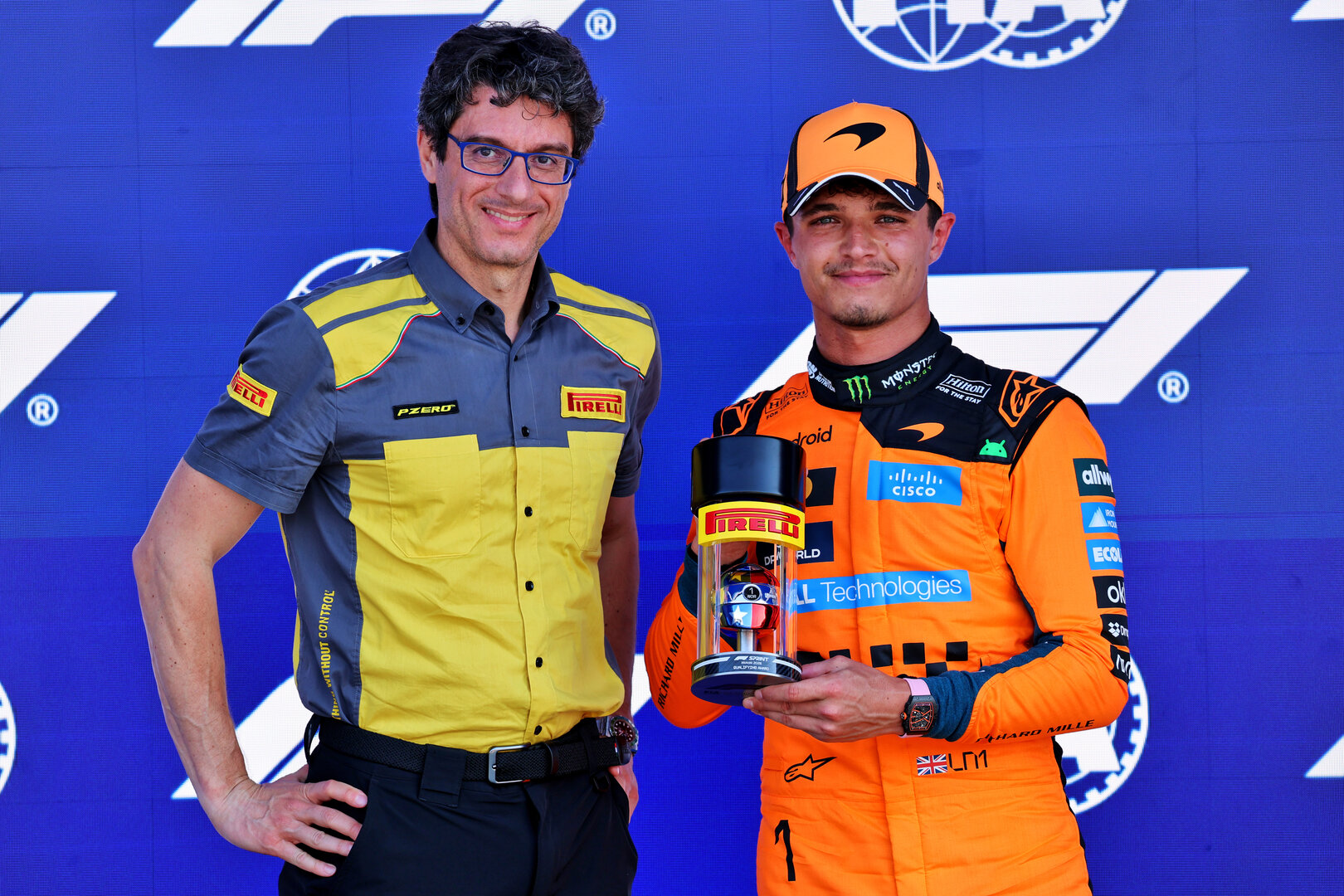 GP MIAMI, (L to R): Dario Marrafuschi (ITA) Head of Pirelli Motorsport Business Unit presents the Pirelli Sprint Qualifiche Pole position Award to Lando Norris (GBR) McLaren F1 Team in parc ferme.
01.05.2026. Formula 1 World Championship, Rd 4, Miami Grand Prix, Miami, Florida, USA, Sprint Qualifiche Day.
- www.xpbimages.com, EMail: requests@xpbimages.com © Copyright: Batchelor / XPB Images