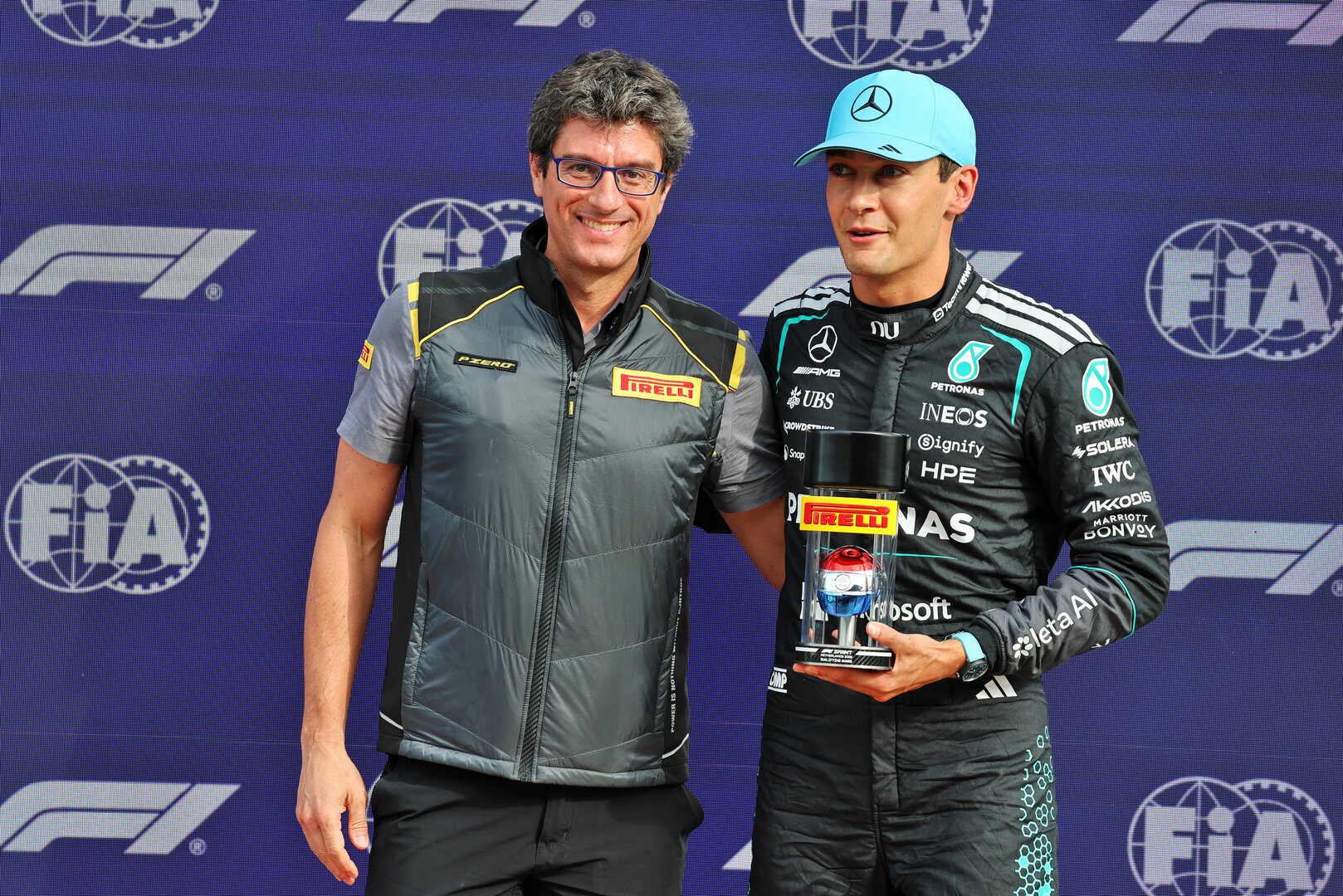 GP OLANDA, George Russell (GBR) Mercedes AMG Formula One Team (Right) celebrates his pole position in Sprint parc ferme with Dario Marrafuschi (ITA) Head of Pirelli Motorsport Business Unit..
21.08.2026. Formula 1 World Championship, Rd 12, Dutch Grand Prix, Zandvoort, Netherlands, Sprint Qualifiche Day.
- www.xpbimages.com, EMail: requests@xpbimages.com © Copyright: Batchelor / XPB Images