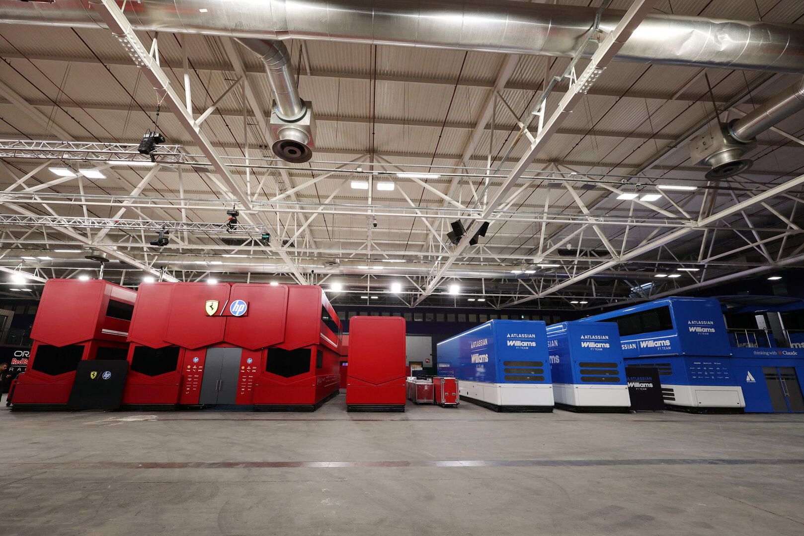 GP SPAGNA, Ferrari e Williams F1 Team trucks in the indoor paddock area.10.09.2026. Formula 1 World Championship, Rd 14, Spanish Grand Prix, Madrid, Spain, Preparation Day.- www.xpbimages.com, EMail: requests@xpbimages.com © Copyright: XPB Images