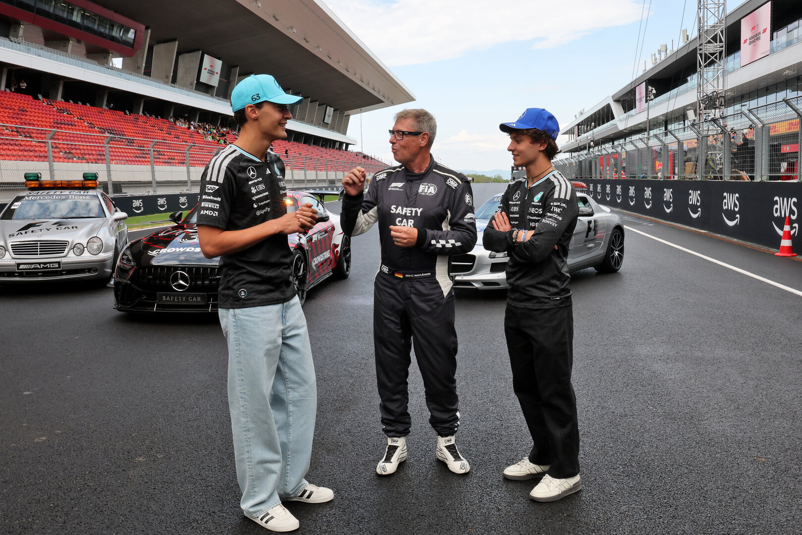 GP UNGHERIA, (L to R): George Russell (GBR) Mercedes AMG Formula One Team; Bernd Maylander (GER) FIA Safety Car Driver; e Andrea Kimi Antonelli (ITA) Mercedes AMG Formula One Team, celebrate 30 years of the Mercedes FIA Safety Car. 
23.07.2026. Formula 1 World Championship, Rd 11, Hungarian Grand Prix, Budapest, Hungary, Preparation Day.
- www.xpbimages.com, EMail: requests@xpbimages.com © Copyright: Moy / XPB Images