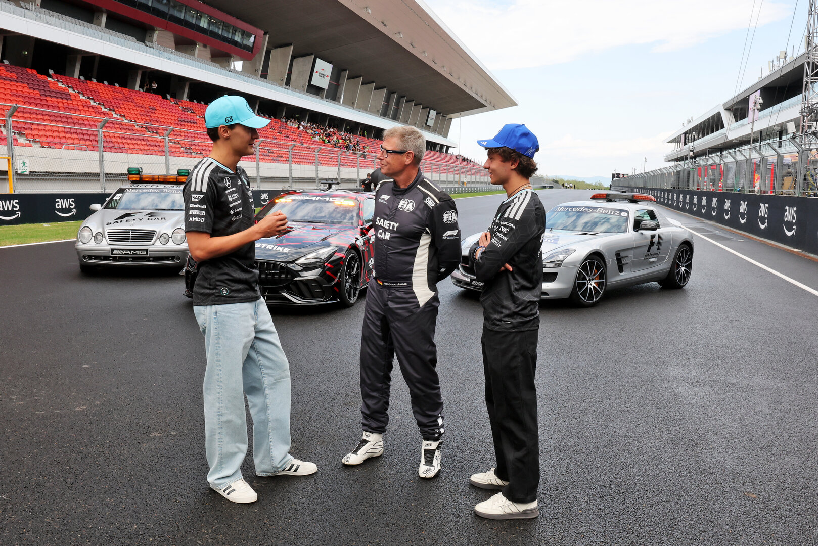 GP UNGHERIA, (L to R): George Russell (GBR) Mercedes AMG Formula One Team; Bernd Maylander (GER) FIA Safety Car Driver; e Andrea Kimi Antonelli (ITA) Mercedes AMG Formula One Team, celebrate 30 years of the Mercedes FIA Safety Car. 
23.07.2026. Formula 1 World Championship, Rd 11, Hungarian Grand Prix, Budapest, Hungary, Preparation Day.
- www.xpbimages.com, EMail: requests@xpbimages.com © Copyright: Moy / XPB Images