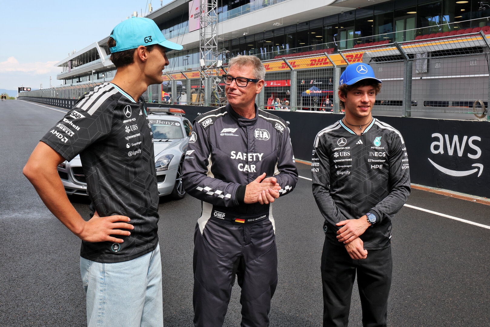 GP UNGHERIA, (L to R): George Russell (GBR) Mercedes AMG Formula One Team; Bernd Maylander (GER) FIA Safety Car Driver; e Andrea Kimi Antonelli (ITA) Mercedes AMG Formula One Team, celebrate 30 years of the Mercedes FIA Safety Car. 
23.07.2026. Formula 1 World Championship, Rd 11, Hungarian Grand Prix, Budapest, Hungary, Preparation Day.
- www.xpbimages.com, EMail: requests@xpbimages.com © Copyright: Moy / XPB Images