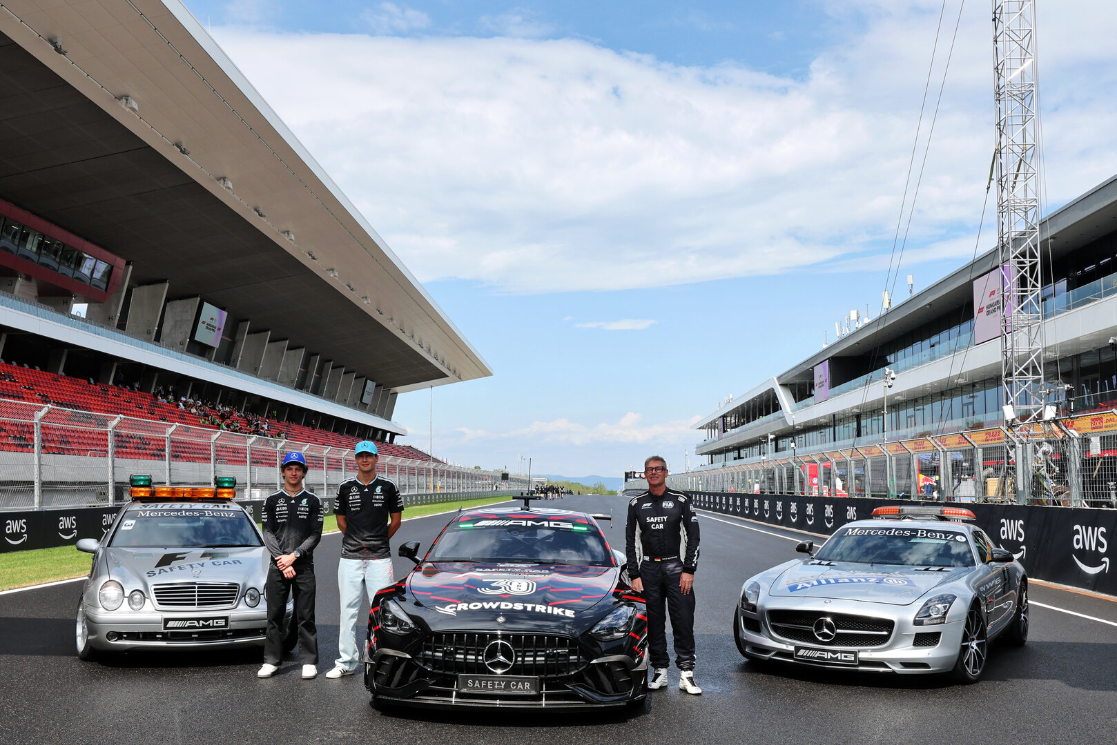 GP UNGHERIA, (L to R): Andrea Kimi Antonelli (ITA) Mercedes AMG Formula One Team; George Russell (GBR) Mercedes AMG Formula One Team; e Bernd Maylander (GER) FIA Safety Car Driver, celebrate 30 years of the Mercedes FIA Safety Car.
23.07.2026. Formula 1 World Championship, Rd 11, Hungarian Grand Prix, Budapest, Hungary, Preparation Day.
- www.xpbimages.com, EMail: requests@xpbimages.com © Copyright: Moy / XPB Images