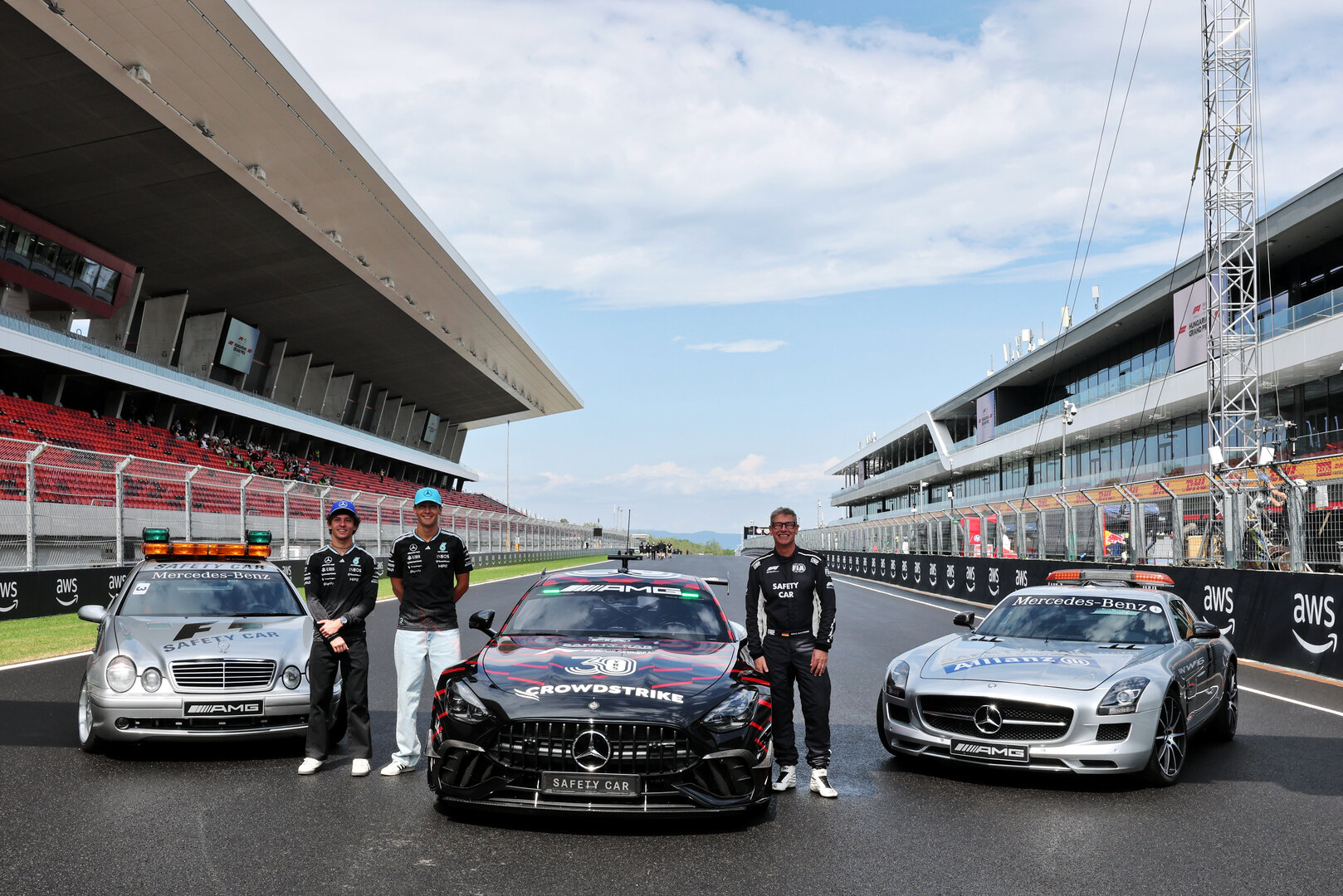 GP UNGHERIA, (L to R): Andrea Kimi Antonelli (ITA) Mercedes AMG Formula One Team; George Russell (GBR) Mercedes AMG Formula One Team; e Bernd Maylander (GER) FIA Safety Car Driver, celebrate 30 years of the Mercedes FIA Safety Car. 
23.07.2026. Formula 1 World Championship, Rd 11, Hungarian Grand Prix, Budapest, Hungary, Preparation Day.
- www.xpbimages.com, EMail: requests@xpbimages.com © Copyright: Moy / XPB Images