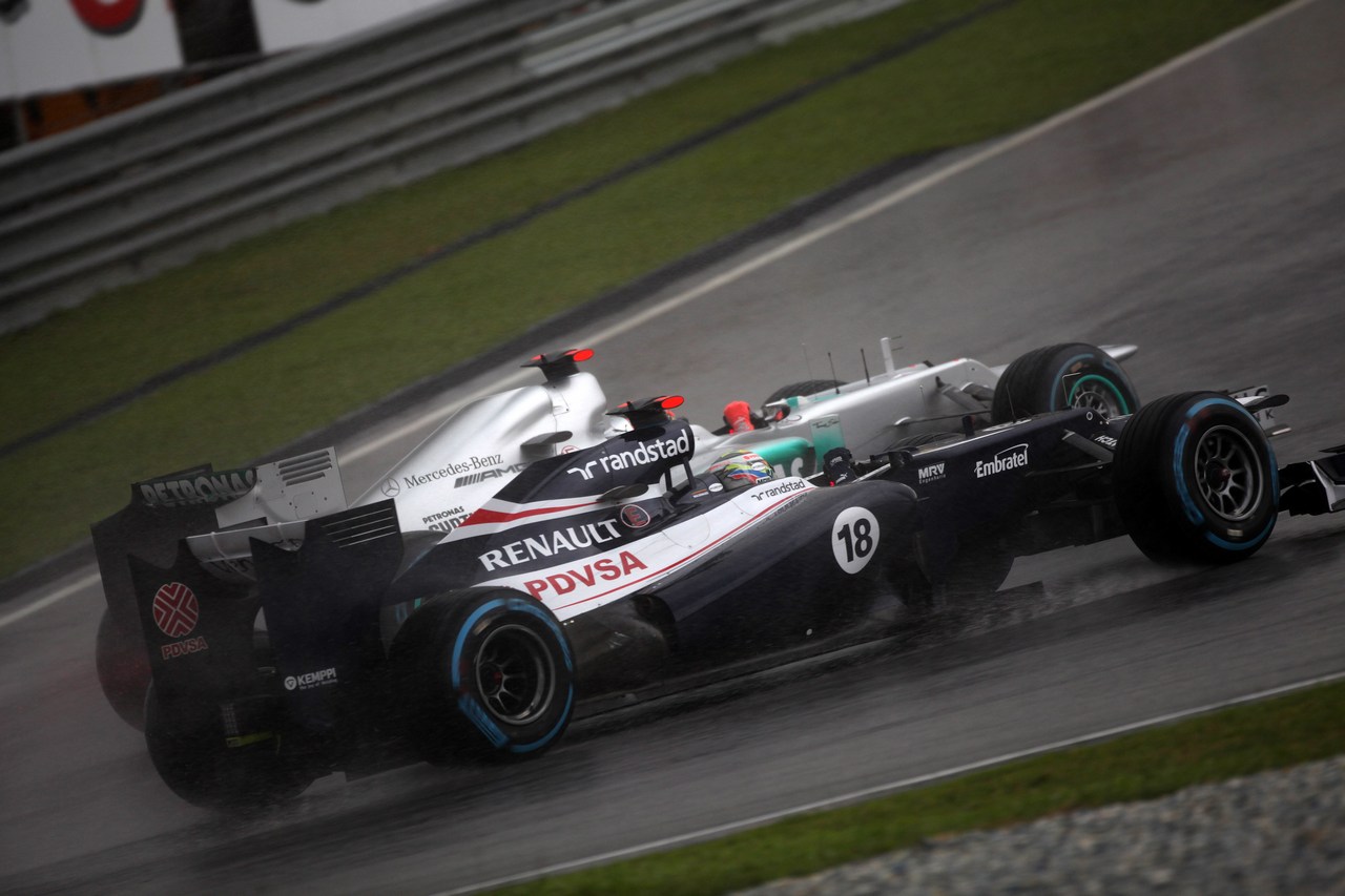25.03.2012- Race, Michael Schumacher (GER) Mercedes AMG F1 W03 and Pastor Maldonado (VEN) Williams F1 Team FW34 