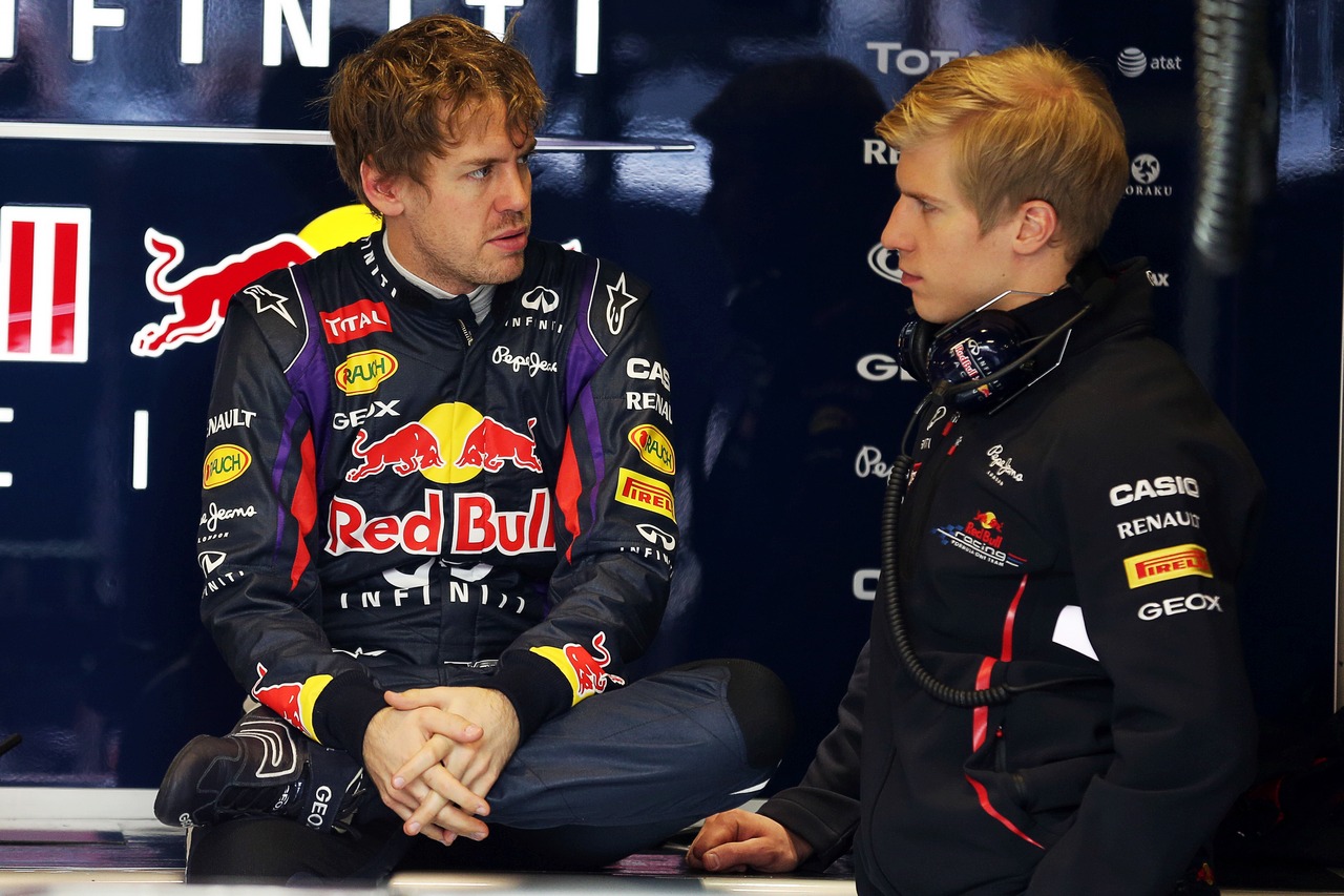 Sebastian Vettel (GER) Red Bull Racing with Heikki Huovinen (FIN) Personal Trainer.
