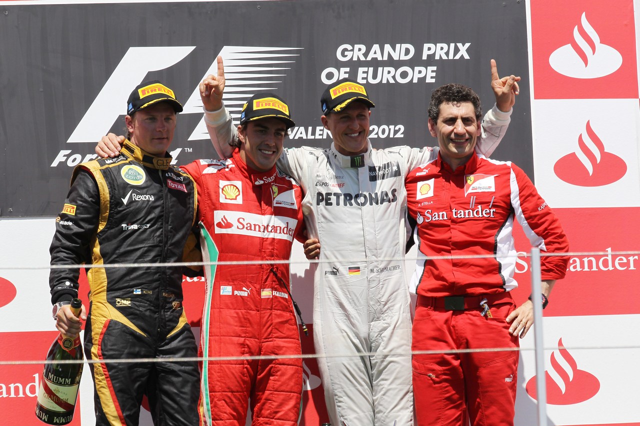 24.06.2012- Race, Fernando Alonso (ESP) Scuderia Ferrari F2012 race winner, 2nd position Kimi Raikkonen (FIN) Lotus F1 Team E20 and 3rd position Michael Schumacher (GER) Mercedes AMG F1 W03 with Andrea Stella (ITA) Ferrari Race Engineer