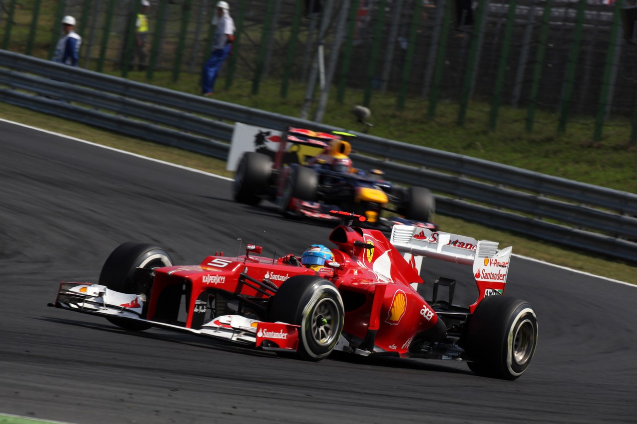 29.07.2012- Race, Fernando Alonso (ESP) Scuderia Ferrari F2012 leads Mark Webber (AUS) Red Bull Racing RB8 