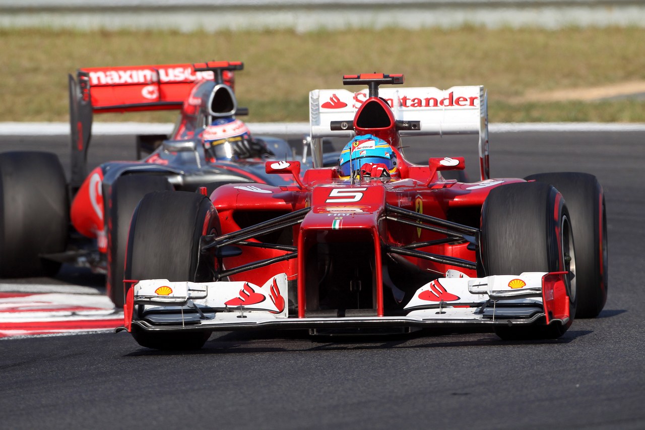 12.10.2012-  Free Practice 2, Fernando Alonso (ESP) Scuderia Ferrari F2012 leads Jenson Button (GBR) McLaren Mercedes MP4-27 