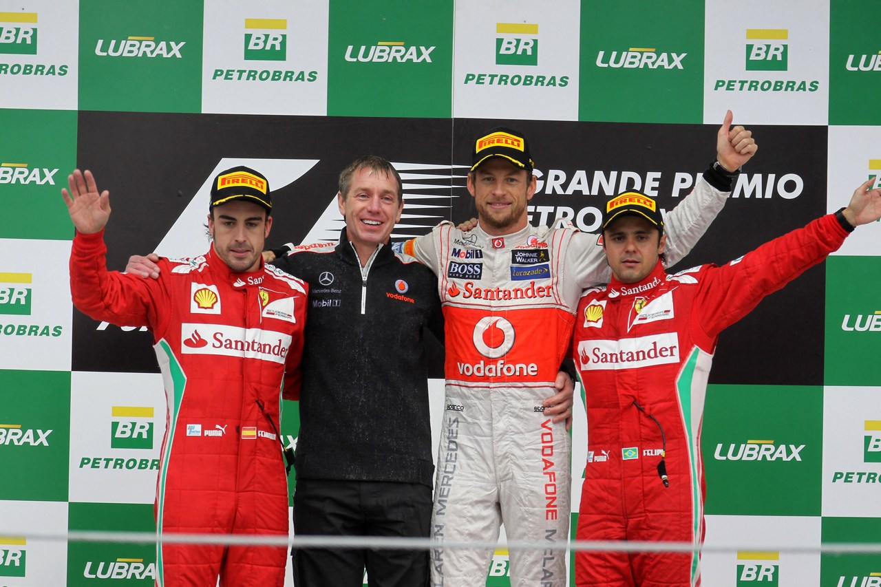 25.11.2012- Race, 2nd position Fernando Alonso (ESP) Scuderia Ferrari F2012, 1st position Jenson Button (GBR) McLaren Mercedes MP4-27 and 3rd position Felipe Massa (BRA) Scuderia Ferrari F2012 