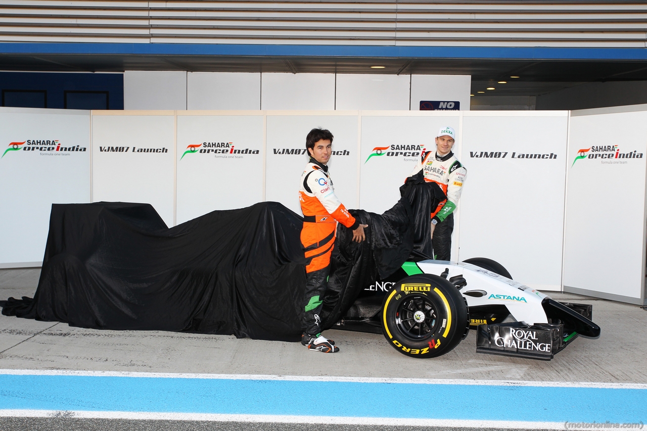 (L to R): Sergio Perez (MEX) Sahara Force India F1 and Nico Hulkenberg (GER) Sahara Force India F1 unveil the new Sahara Force India F1 VJM07. 
28.01.2014. Formula One Testing, Day One, Jerez, Spain.