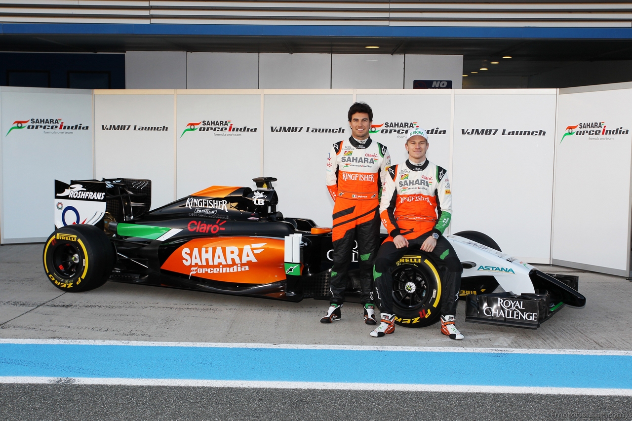 (L to R): Sergio Perez (MEX) Sahara Force India F1 and team mate Nico Hulkenberg (GER) Sahara Force India F1 at the launch of the new Sahara Force India F1 VJM07. 
28.01.2014. Formula One Testing, Day One, Jerez, Spain.