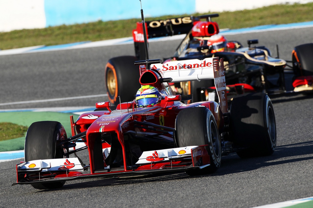 Felipe Massa (BRA) Ferrari F138 leads Romain Grosjean (FRA) Lotus F1 E21.

