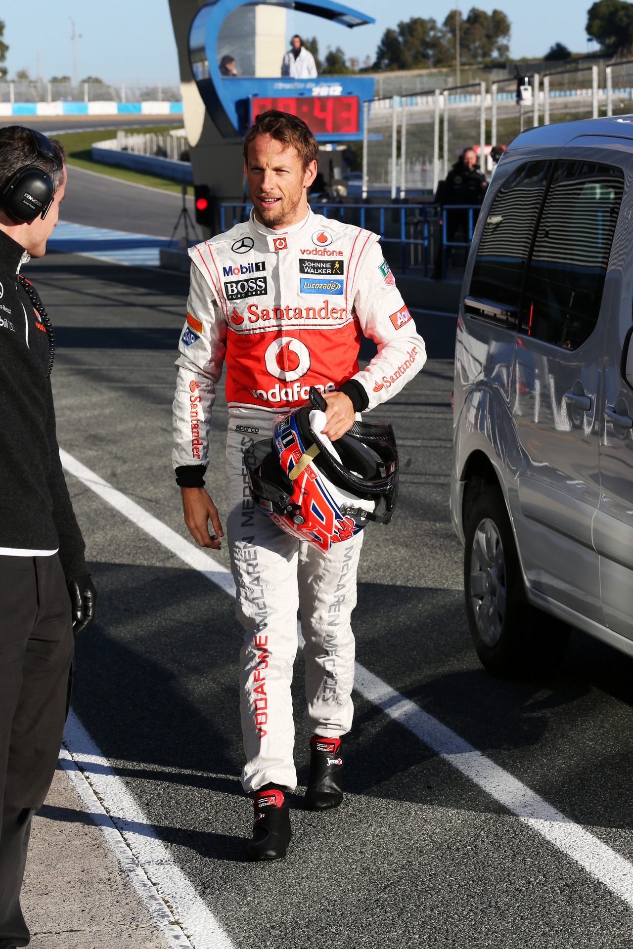 Jenson Button (GBR) McLaren returns to the pits after stopping on the circuit.
