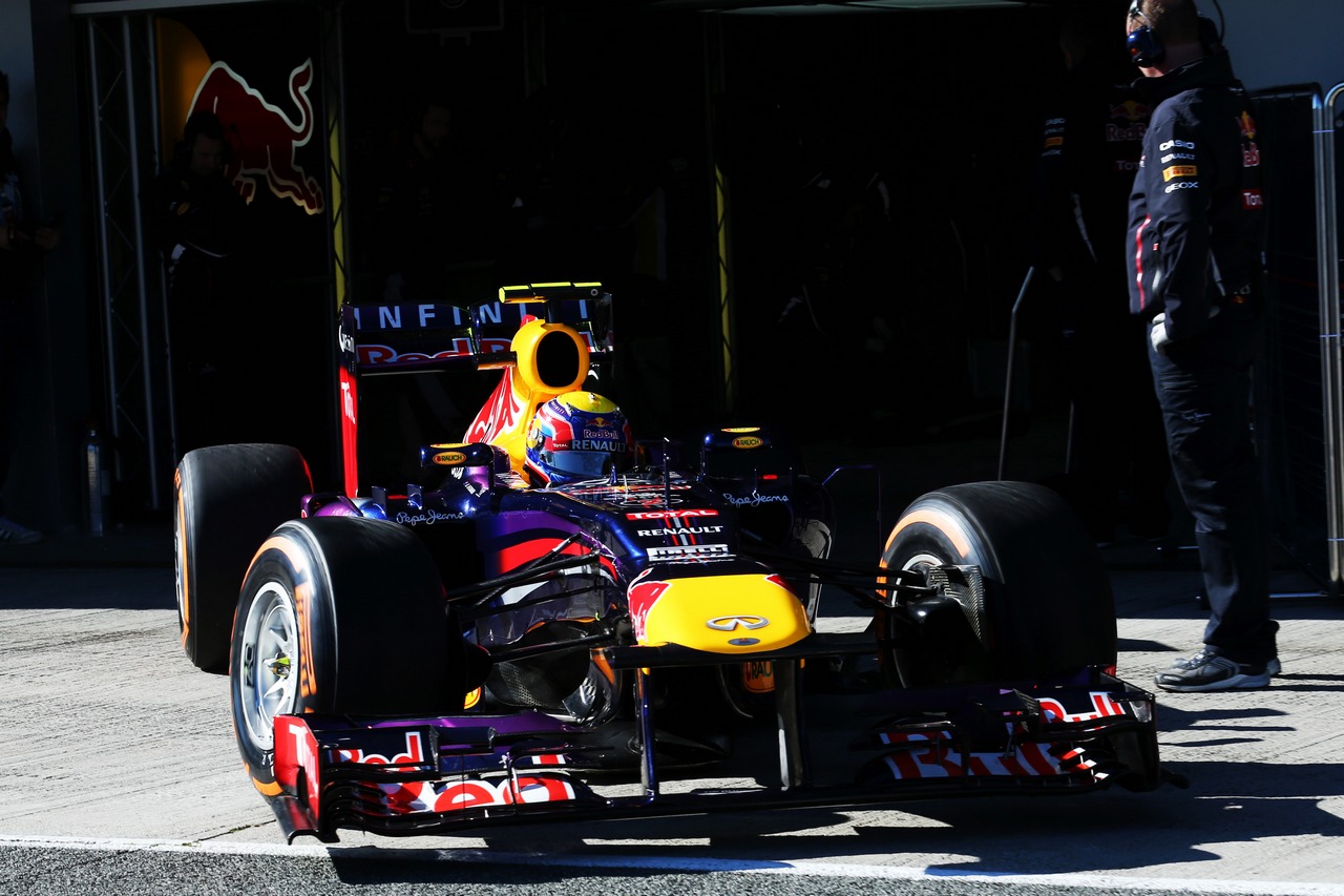 Mark Webber (AUS) Red Bull Racing RB9 leaves the pits.
