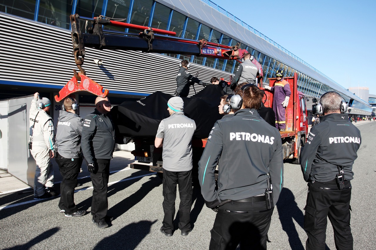The Mercedes AMG F1 W04 of Nico Rosberg (GER) Mercedes AMG F1 is recovered back to the pits on the back of a truck.
