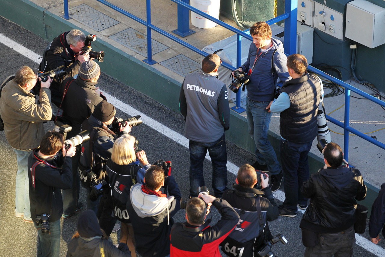 Lewis Hamilton (GBR) Mercedes AMG F1 with photographers.

