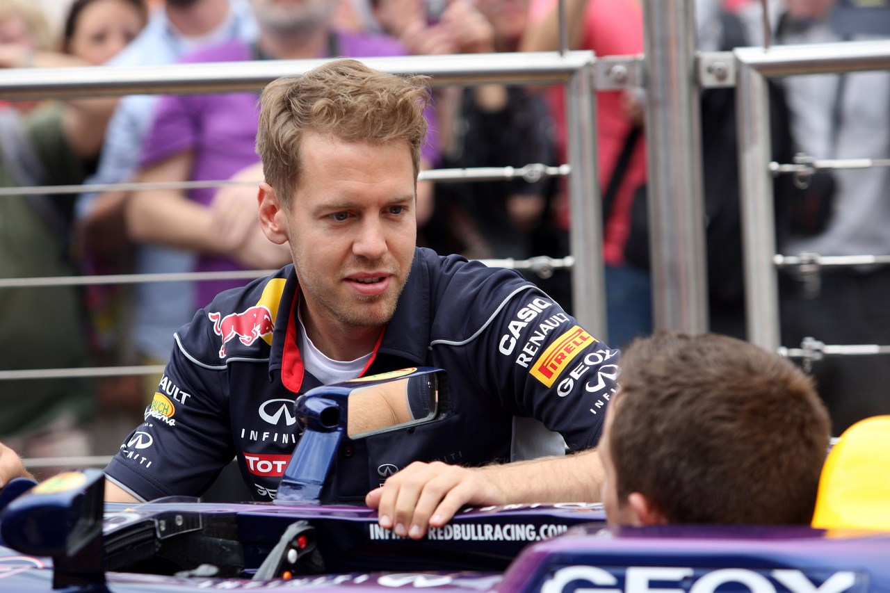 22.05.2013- Sebastian Vettel (GER) Red Bull Racing RB9 and Sebastien Ogier (F) WRC Driver