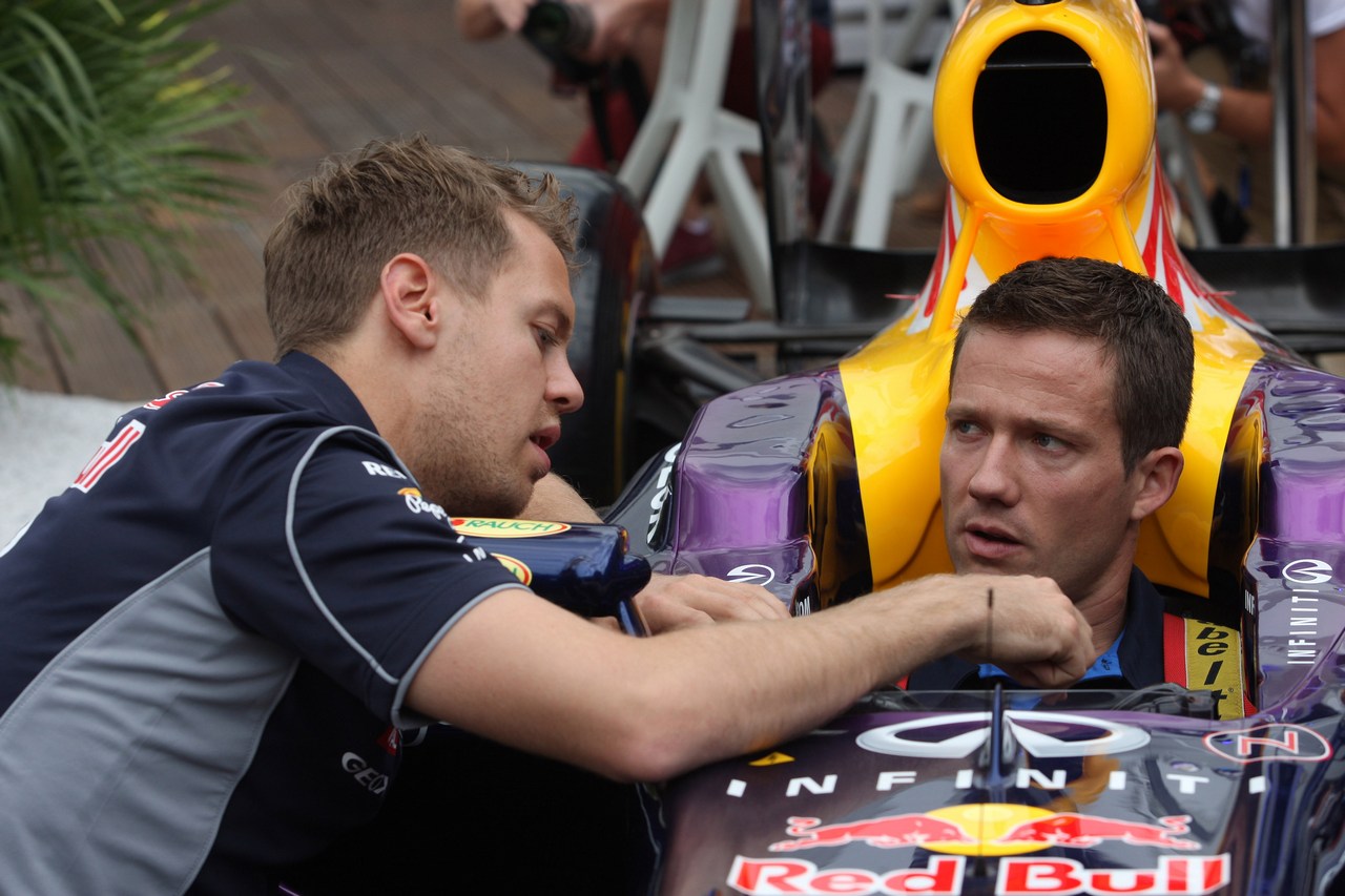 22.05.2013- Sebastian Vettel (GER) Red Bull Racing RB9 and Sebastien Ogier (F) WRC Driver