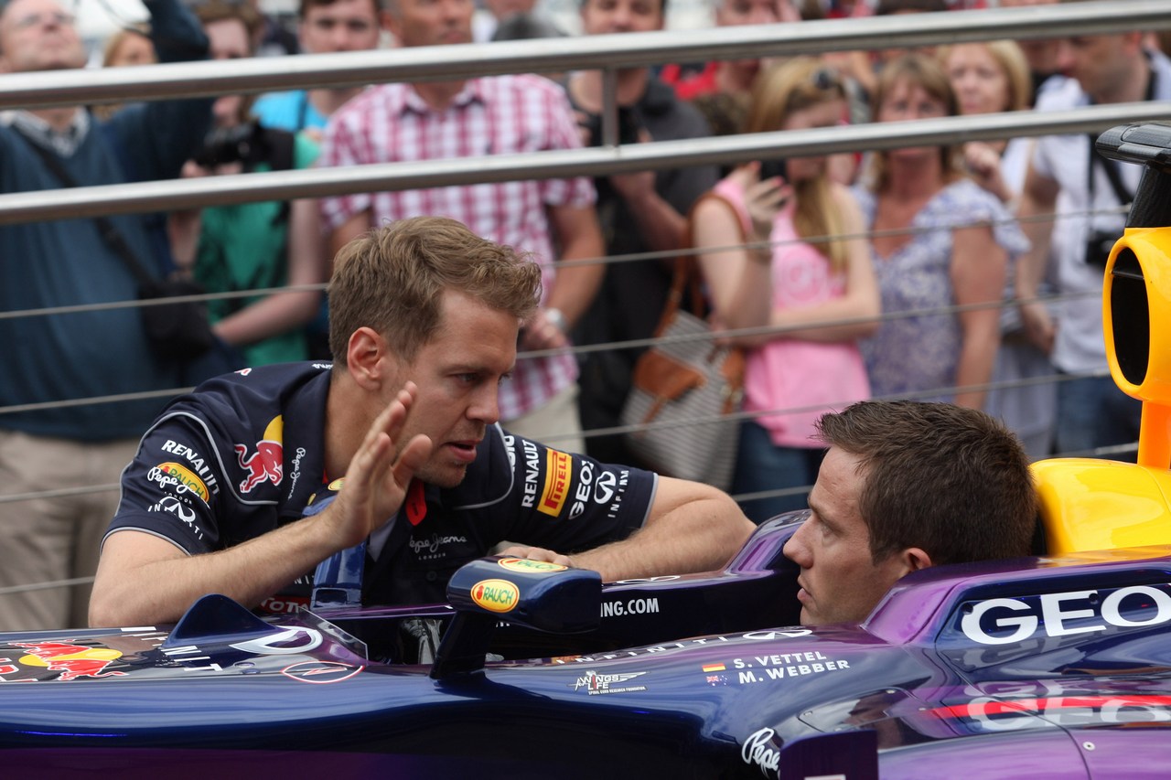 22.05.2013- Sebastian Vettel (GER) Red Bull Racing RB9 and Sebastien Ogier (F) WRC Driver