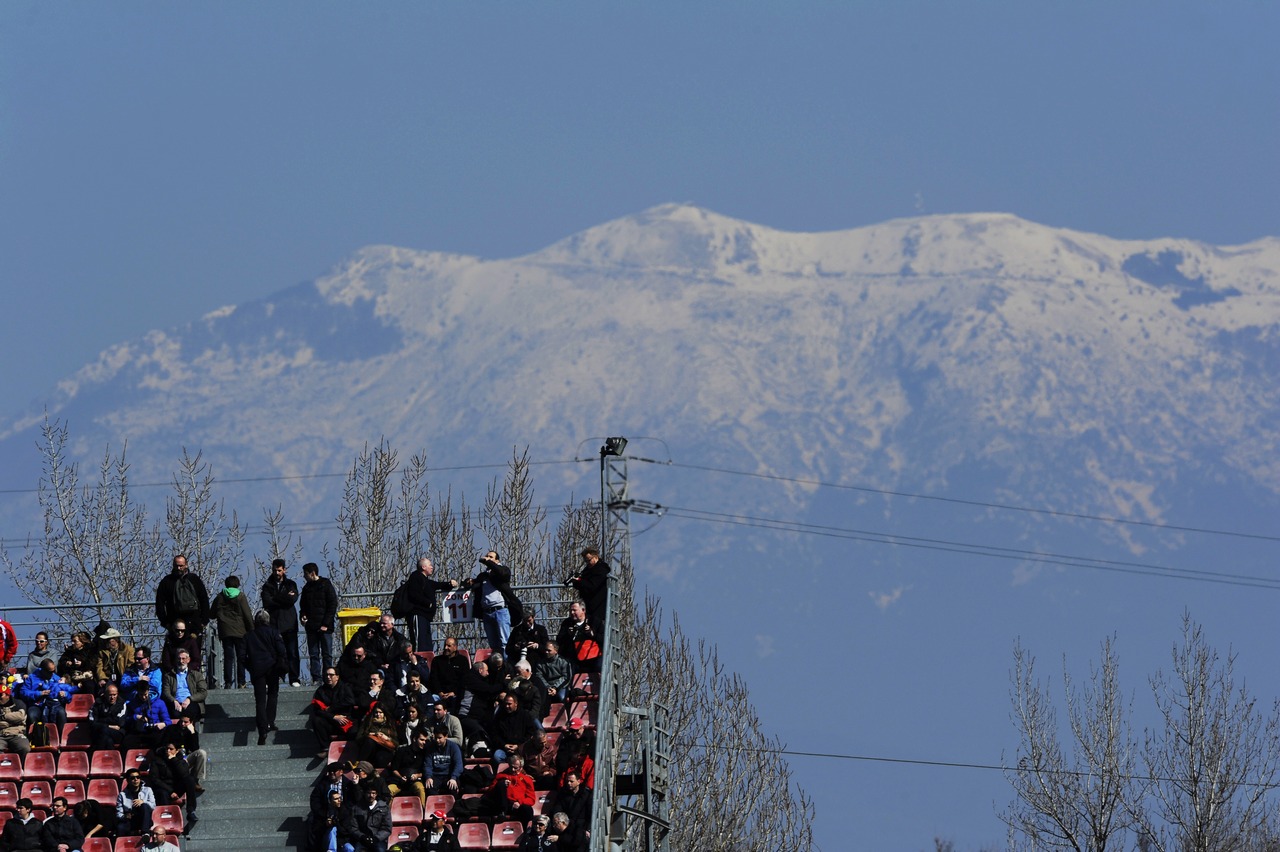 Fans in the grandstand with snow on the mountains.
02.03.2013. 