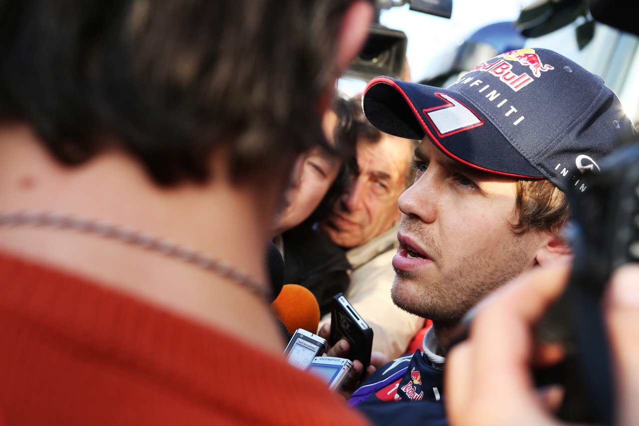 Sebastian Vettel (GER) Red Bull Racing with the media.
