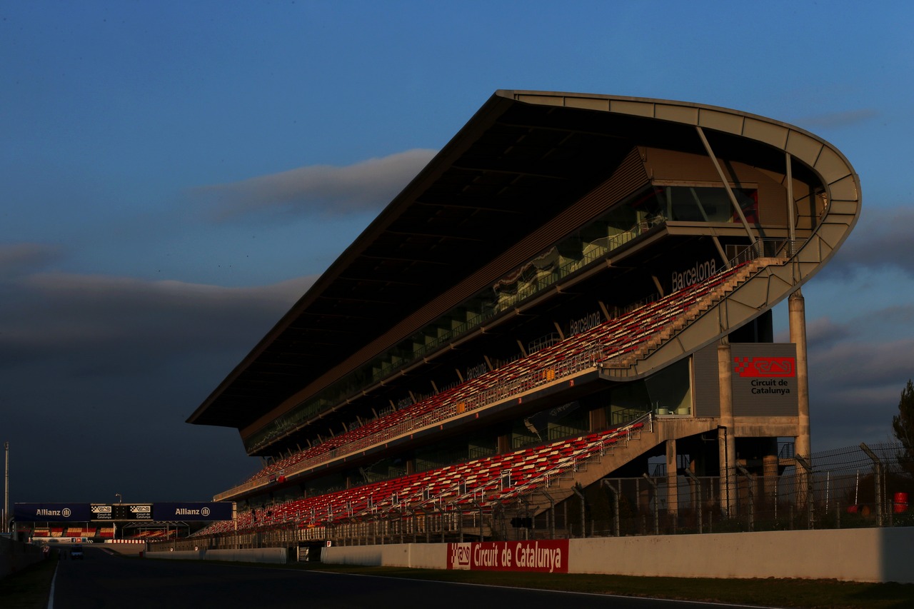 Circuit grandstand at sunset.
