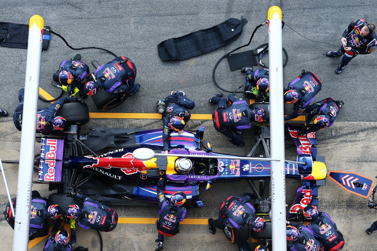 Sebastian Vettel (GER) Red Bull Racing RB9 practices a pit stop.
