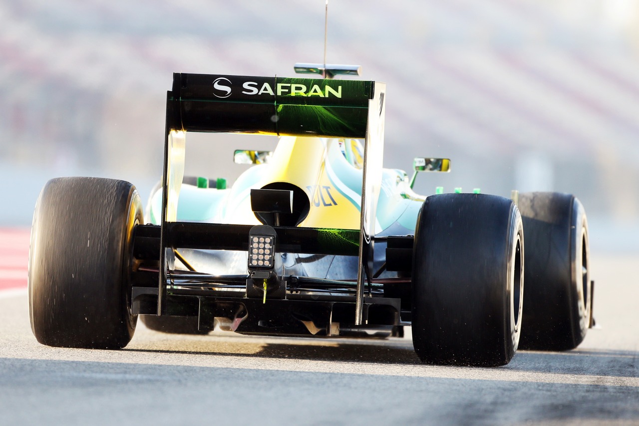 Caterham CT03 running flow-vis paint on the rear wing.
