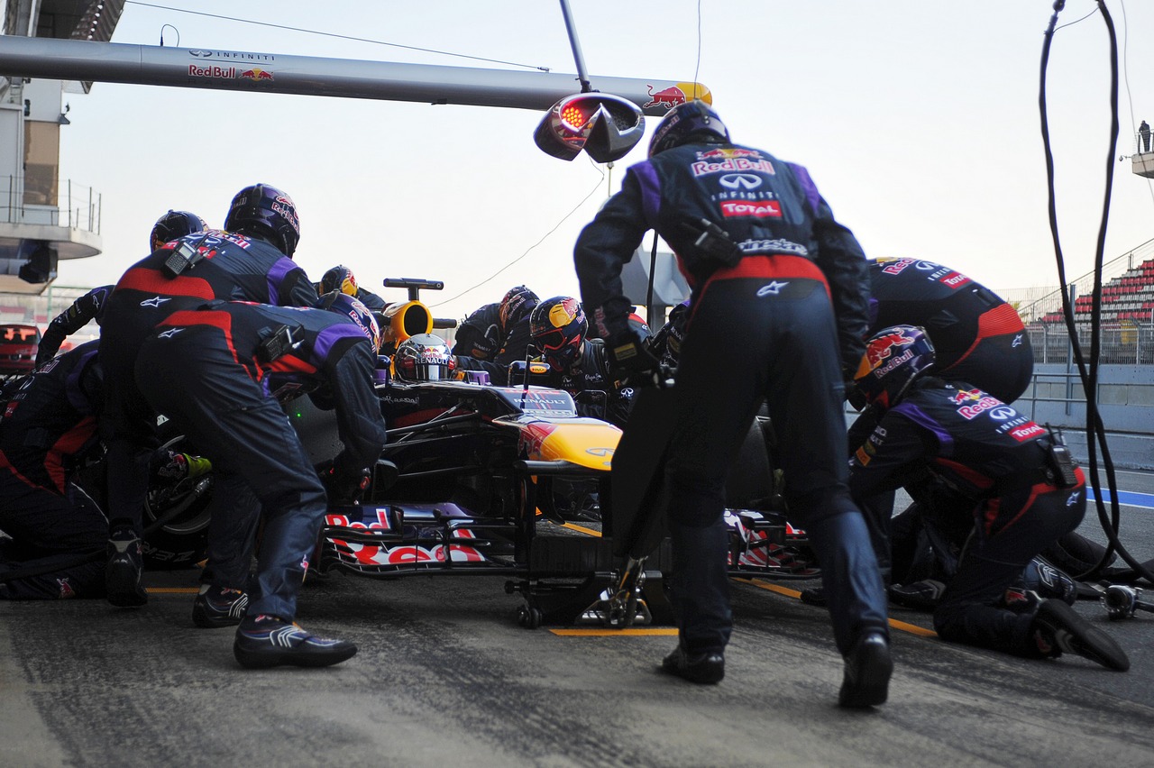Sebastian Vettel (GER) Red Bull Racing RB9 practices a pit stop.
